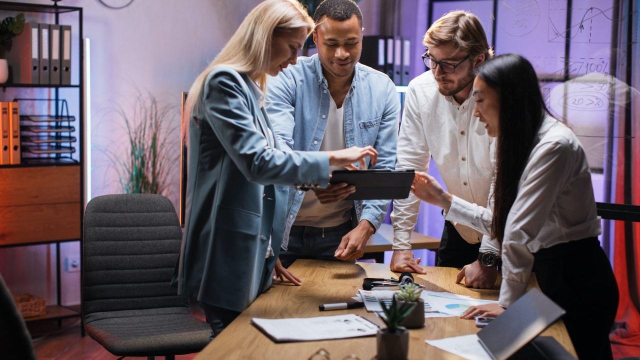 team-of-financial-experts-using-tablet-during-brainstorming